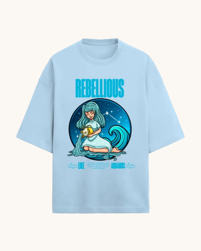 Light blue t-shirt with a graphic design of a woman holding a fruit, surrounded by a wave and stars, with 'Rebellious' text.