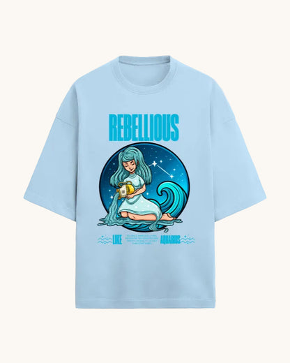Light blue t-shirt with a graphic design of a woman holding a fruit, surrounded by a wave and stars, with 'Rebellious' text.