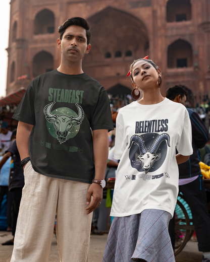 Two people wearing t-shirts with graphic designs in front of a historic building.