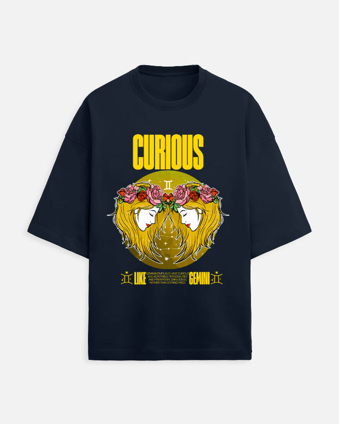 Black t-shirt with a graphic design featuring a face with flowers and the word 'Curious' on a white background.