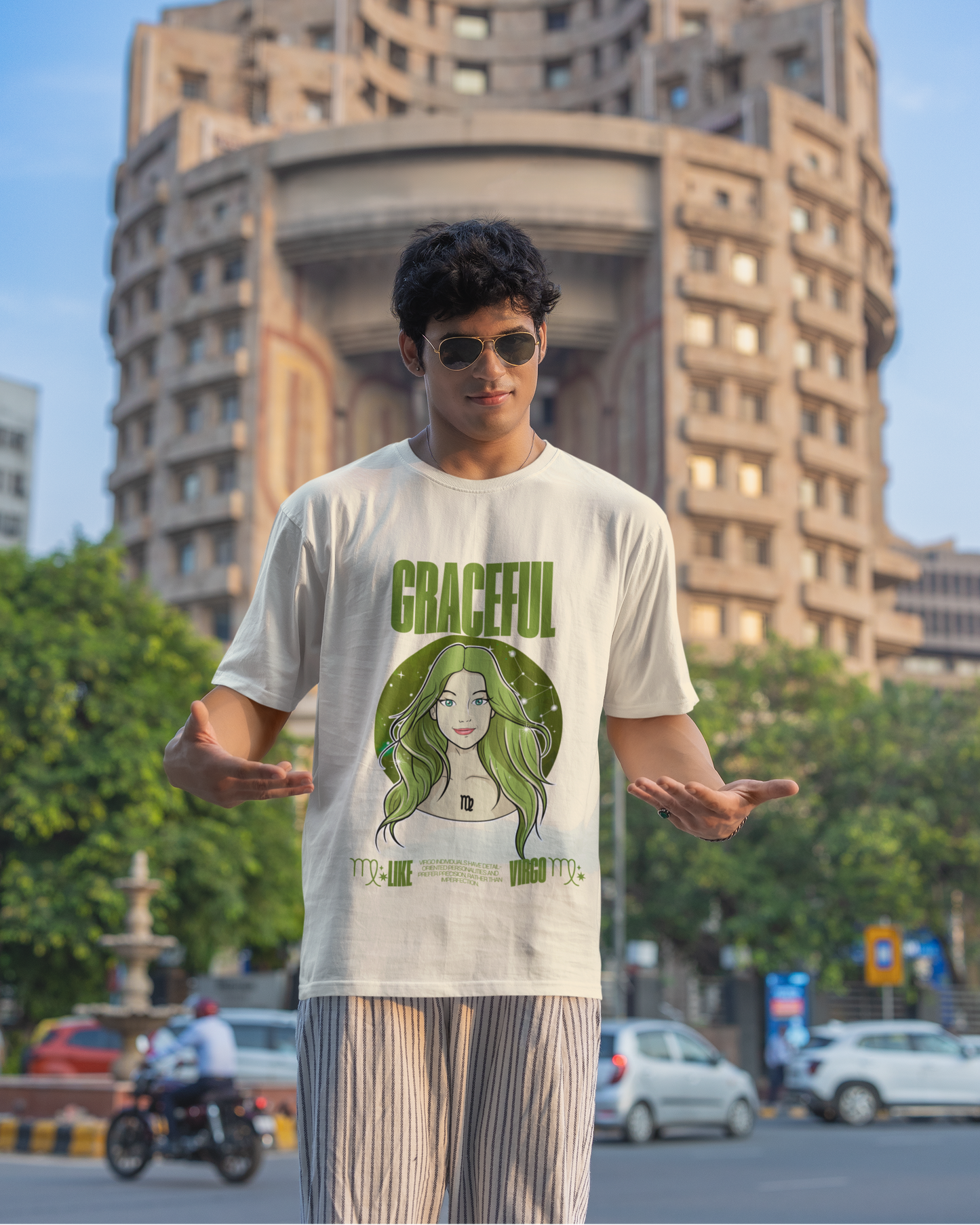 Person wearing a t-shirt with a graphic design in an urban setting
